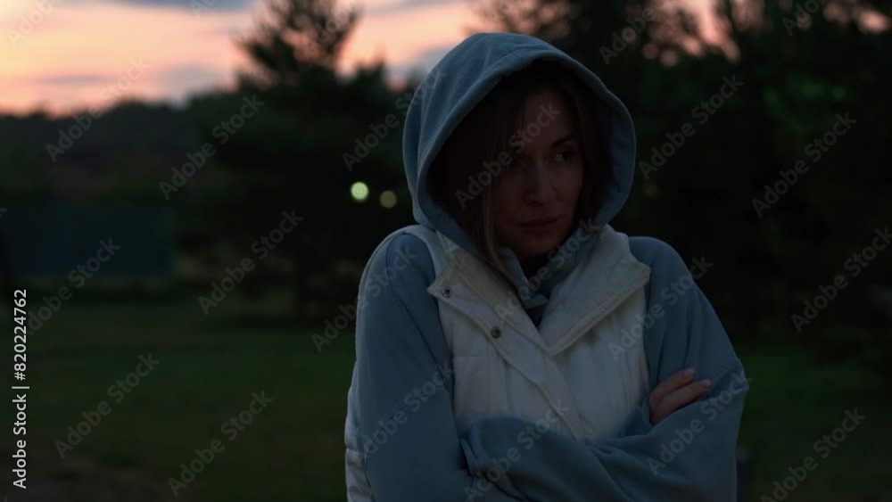 Portrait of young and beautiful woman standing alone and waiting for someone at the coast of the foggy lake Portrait of young and beautiful woman standing alone and waiting for someone at the coast of the foggy lake