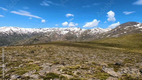 Panoramic view on snowy mountains on hiking trail to Mulhacen peak in the spring, Sierra Nevada range, Andalusia, Spain