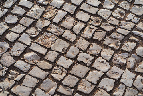 Photo background texture of an old calzada on the streets of Lisbon in Portugal.