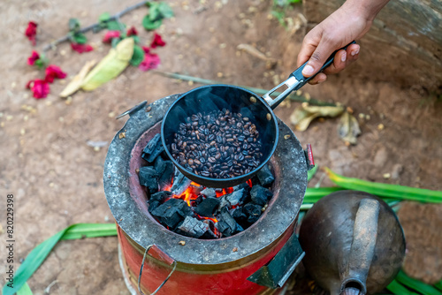 Ethiopia, fresh coffee beans  are rosted in a pan in the  area of Sidama.