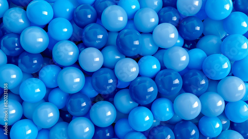 Many blue gradient random bright soft balls background. Blue balls background for kids zone or children's playroom. Huge pile of blue balls in different sizes