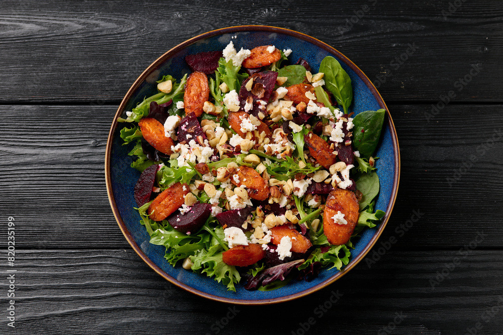 Warm baked carrots and beetroot salad with feta cheese and roasted hazelnuts Warm baked carrots and beetroot salad with feta cheese and roasted hazelnuts