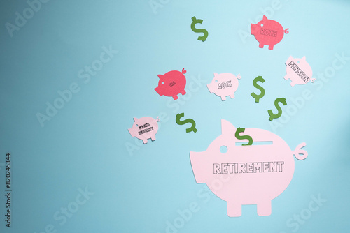 Retirement savings planning concept, IRA, 401K, pension, roth social security.  Piggy bank on blue background. photo