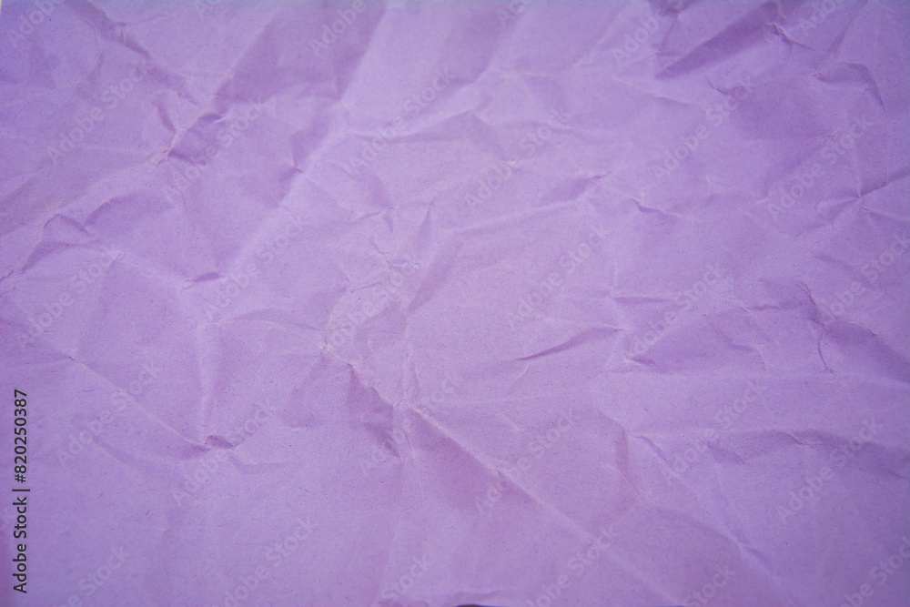 Purple color background with little wrinkles. Purple recycled craft paper texture as background.