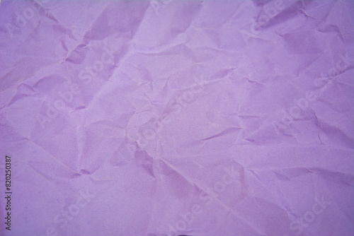 Purple color background with little wrinkles. Purple recycled craft paper texture as background.