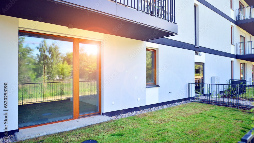 The garden of a modern residential building with a green lawn and a place to relax. The garden of a modern residential building with a green lawn and a place to relax.
