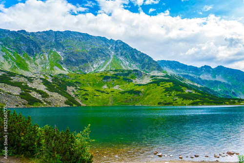 Fototapeta Naklejka Na Ścianę i Meble -  Tatra National Park in Poland. Mountains lake Morskie oko or Sea Eye lake In High Tatras. Five lakes valley