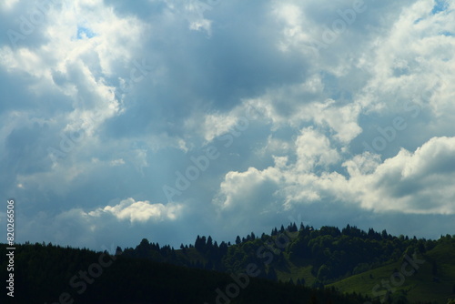 A landscape with clouds and trees