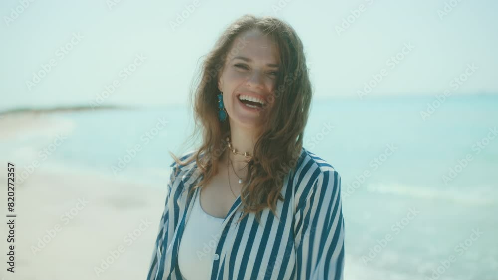happy elegant female on the seacoast having fun time. happy elegant female on the seacoast having fun time.