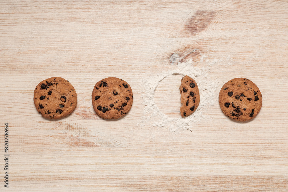 Sweet cookies with chocolate chips on wooden background Sweet cookies with chocolate chips on wooden background
