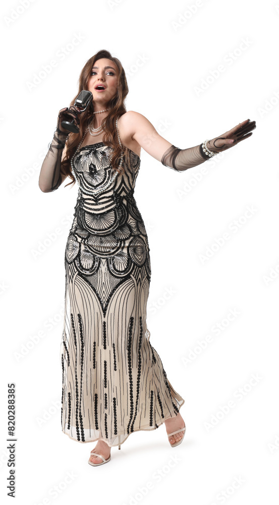 Beautiful young woman in stylish dress with microphone singing on white background Beautiful young woman in stylish dress with microphone singing on white background