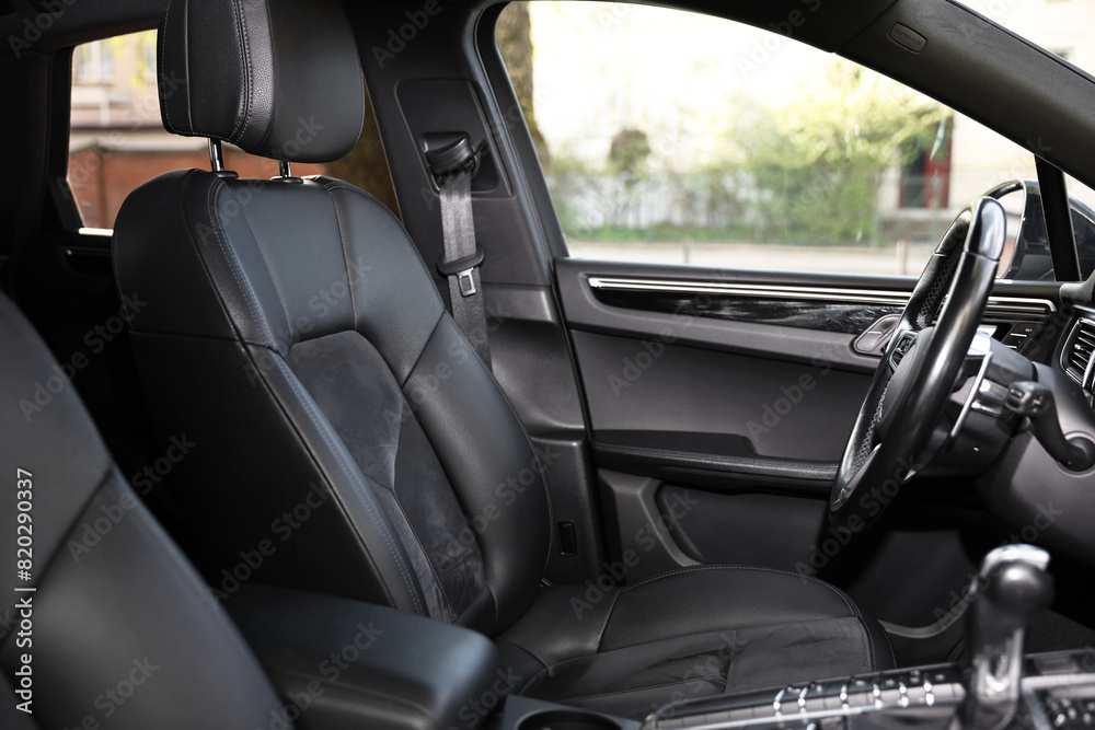 Inside of modern black car with leather seats Inside of modern black car with leather seats