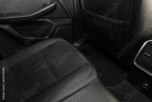 Leather seat inside of modern black car, closeup © New Africa
