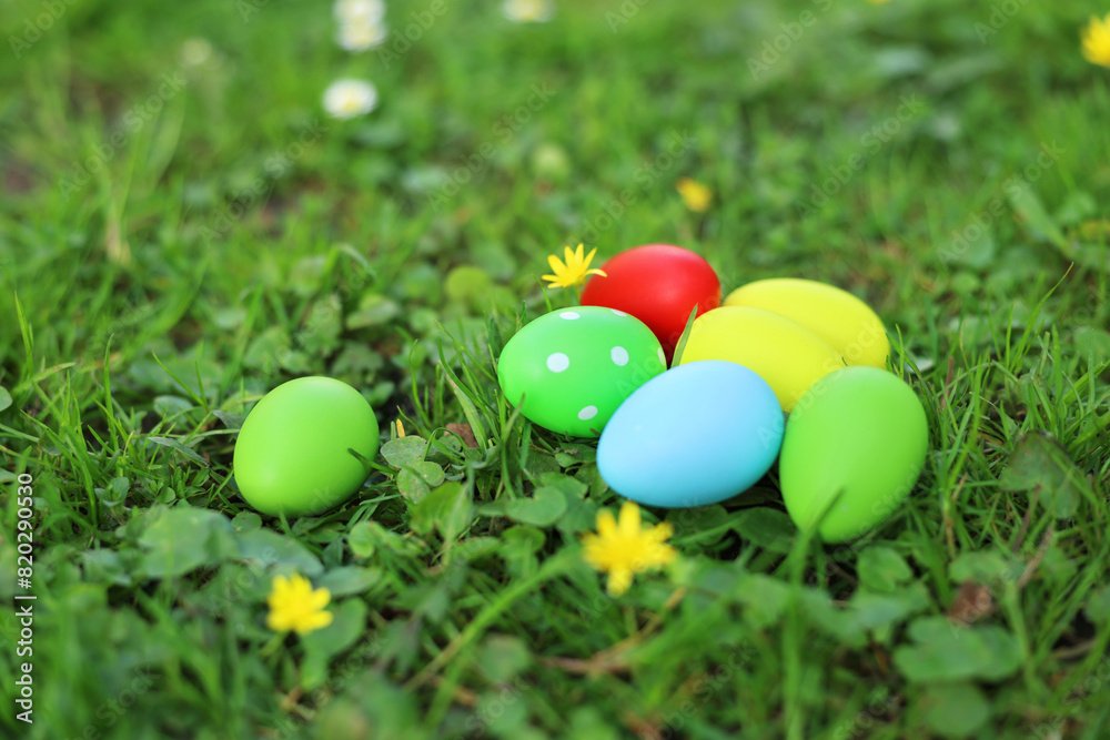 Easter celebration. Painted eggs on green grass