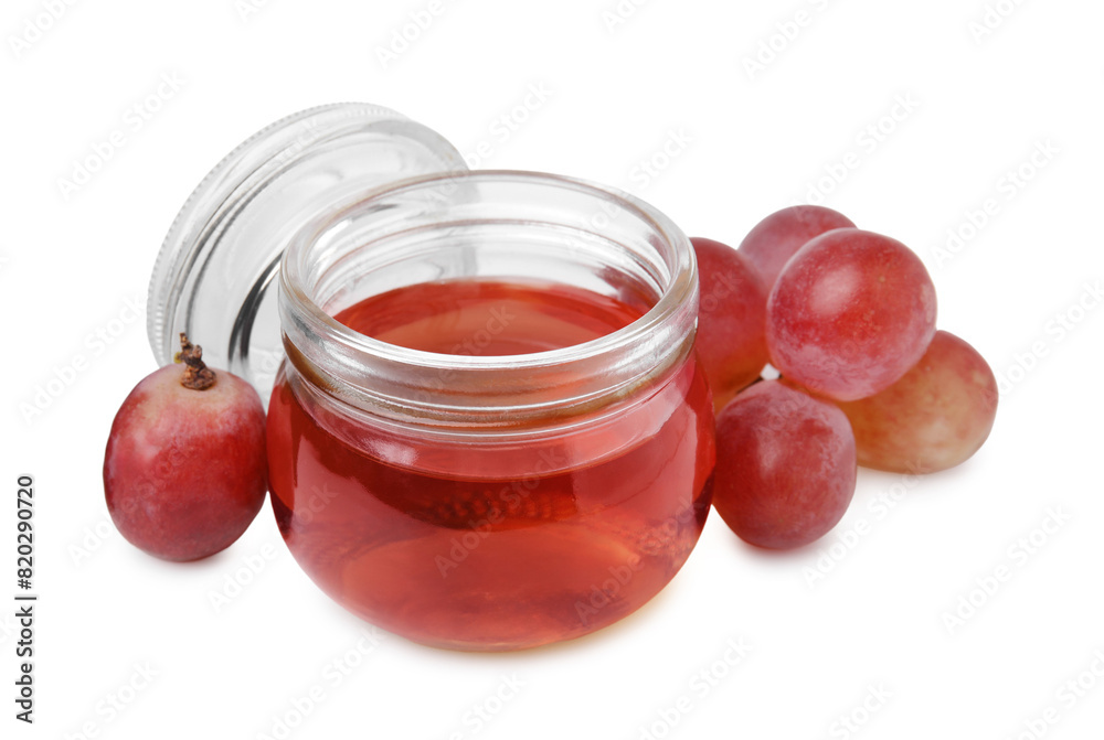 Wine vinegar in jar and grapes isolated on white Wine vinegar in jar and grapes isolated on white
