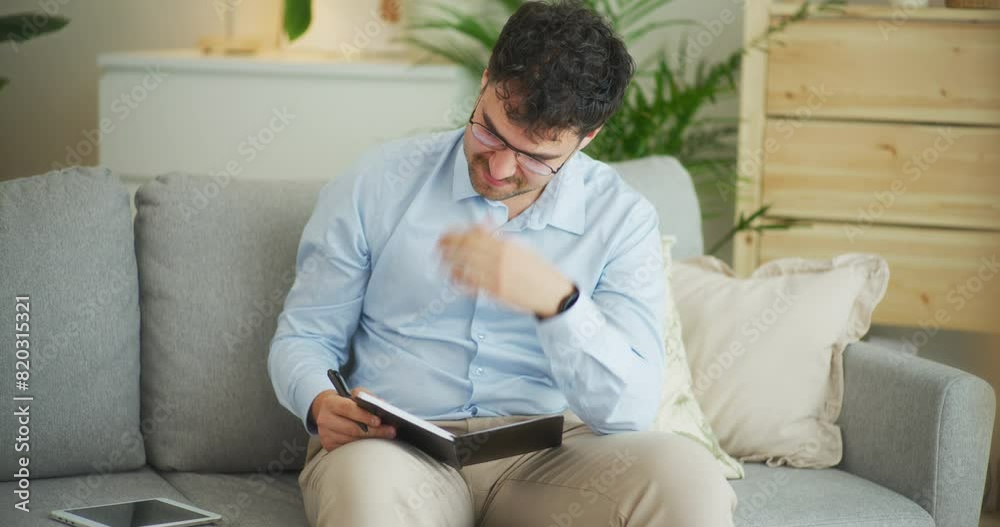 Sad Man Writes Strategies in Notebook Sad Man Writes Strategies in Notebook
