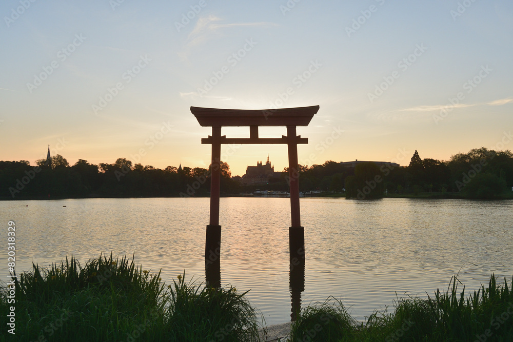 Metz, France. Torii gates mark the transition from the human world to the sacred space of Shinto shrines in Japan and the cathedral (Cathédrale Saint-Etienne de Metz) at sunrise. May 10, 2024. Metz, France. Torii gates mark the transition from the human world to the sacred space of Shinto shrines in Japan and the cathedral (Cathédrale Saint-Etienne de Metz) at sunrise. May 10, 2024.