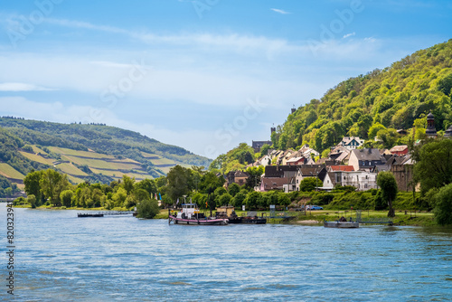 View of Trechtingshausen town on bank of Rhine River in Rhineland-Palatinate, Germany. Rhine valley is famous tourist destination for romantic river cruise and short vacation photo