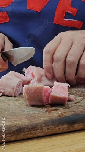 vertical video of step-by-step preparation of traditional Argentine food for national holidays at a family reunion with a huge pot for many portions 2