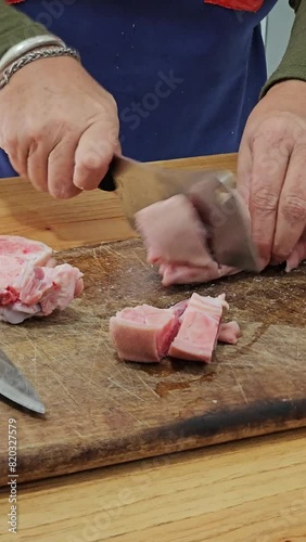 vertical video of step-by-step preparation of traditional Argentine food for national holidays at a family reunion with a huge pot for many portions