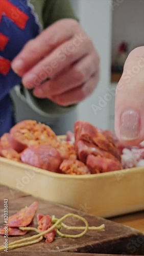 vertical video of step-by-step preparation of traditional Argentine food for national holidays at a family reunion with a huge pot for many portions 10