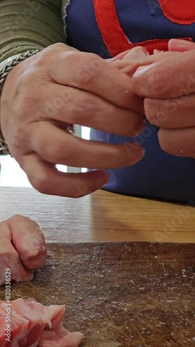 vertical video of step-by-step preparation of traditional Argentine food for national holidays at a family reunion with a huge pot for many portions 5