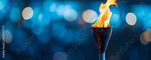 Elegant torch flame against bokeh background photo