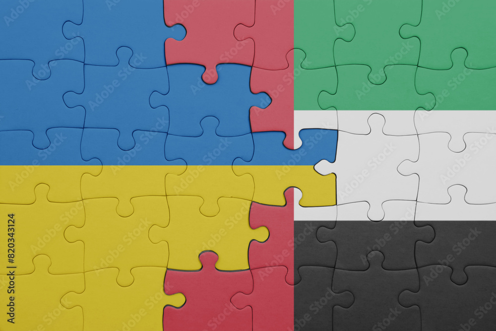 puzzle with the colourful national flag of united arab emirates and flag of ukraine. puzzle with the colourful national flag of united arab emirates and flag of ukraine.