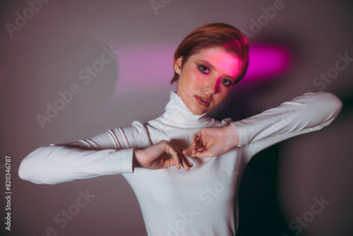 Portrait of young woman hidden in the shadow Young model in cyberpunk fashion style