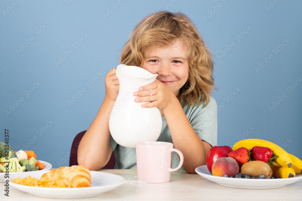 Child drink dairy milk. Healthy child pours milk from jug. Child drink dairy milk. Healthy child pours milk from jug.