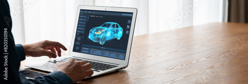 Electric car design software on computer screen showing simulation blueprint snugly by digital calculating application for manufacturing preparation