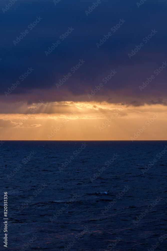 Panoramic view of the cloudy Aegean Sea and a golden  sunrise