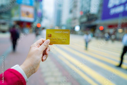 Photography Travel card, Tourist woman showing credit card or travel card for convenient travel Make shopping easy enjoy lifestyle travel city at shopping street on holiday vacation in Hongkong