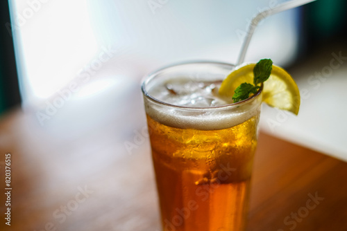 Lychee Iced Tea or Es Leci tea with Mint Leaves in a Glass photo