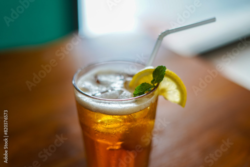 Lychee Iced Tea or Es Leci tea with Mint Leaves in a Glass photo