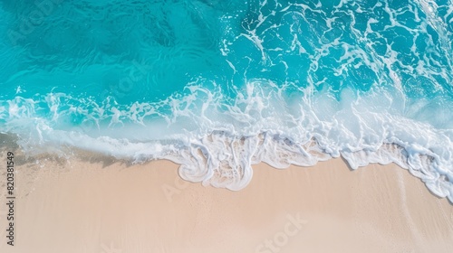 the concept of World Ocean Day. Beautiful nature landscape. World Water Day. Beautiful ocean waves and white sand, view from above. © Mentari