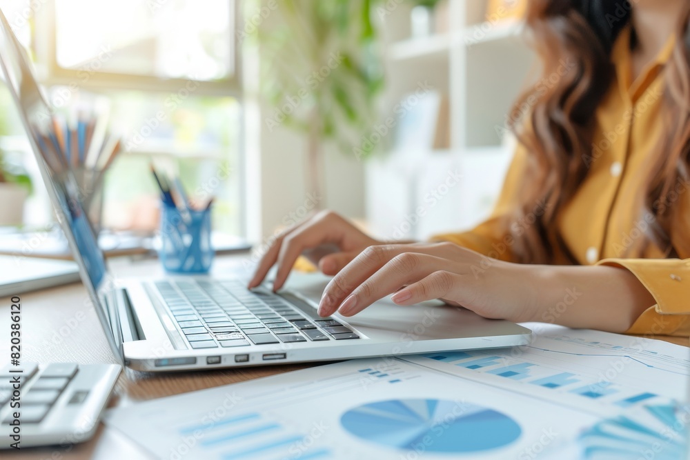 Fototapeta premium Close up of business person or accountant using laptop, Planning financial and accounting concept