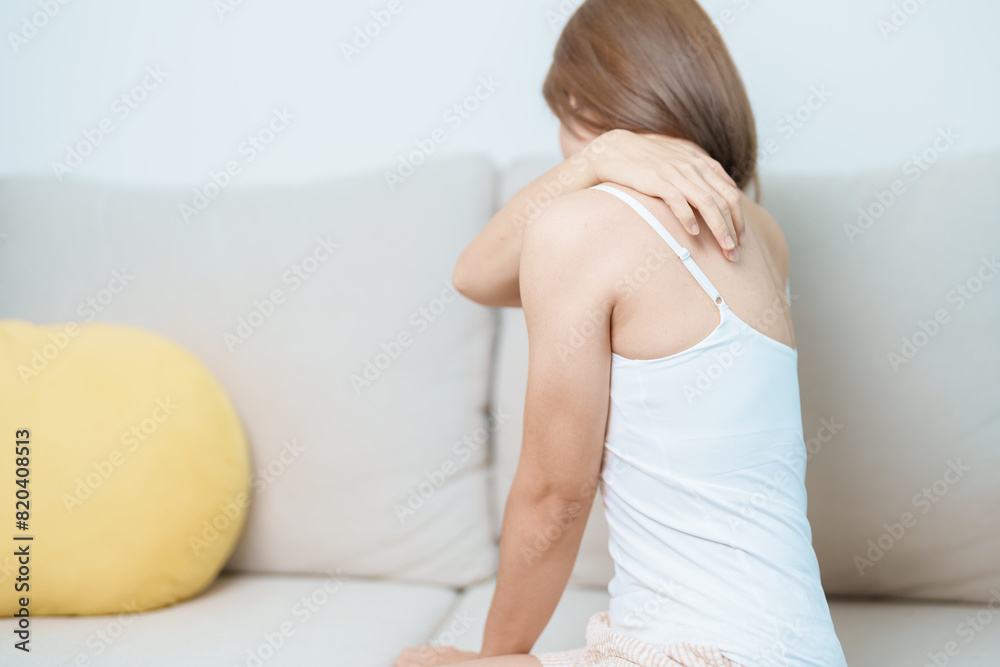 Woman having Shoulder and Neck pain at home. Muscle painful due to Myofascial pain syndrome and Fibromyalgia, rheumatism, Scapular pain, Cervical Spine. ergonomic concept Woman having Shoulder and Neck pain at home. Muscle painful due to Myofascial pain syndrome and Fibromyalgia, rheumatism, Scapular pain, Cervical Spine. ergonomic concept