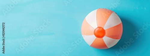 Sun-Kissed Essentials: Beach Ball and Summer Accessories on Blue Background