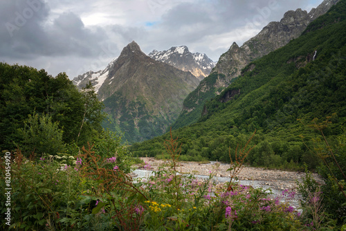 View of the Dombay-Ulgen gorge in the mountains of the North Caucasus near the village of Dombay on a sunny summer day, Karachay-Cherkessia, Russia