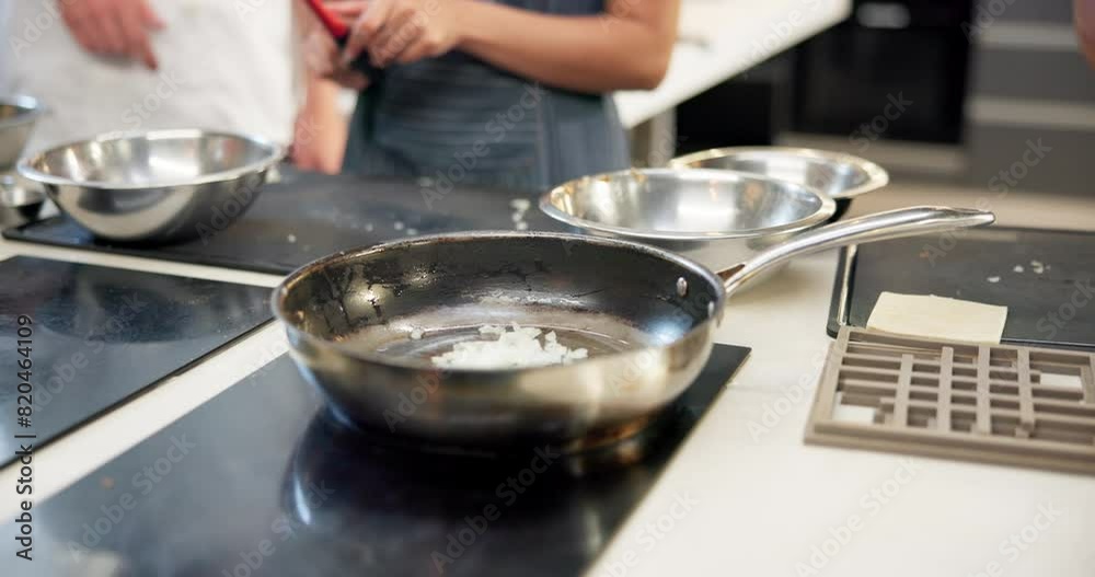 Hands, cooking class and pan in kitchen for learn, teacher and food for professional skills. Restaurant, fry or culinary student with oil for saute, onion or vegetables for prepare on hot stove top Hands, cooking class and pan in kitchen for learn, teacher and food for professional skills. Restaurant, fry or culinary student with oil for saute, onion or vegetables for prepare on hot stove top