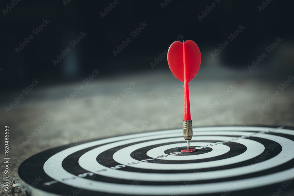 Dart arrow hit on bulleyes of dartboard to business. Dart is an opportunity and Dartboard is the target and goal. So both of that represent a challenge in business marketing as concept. Dart arrow hit on bulleyes of dartboard to business. Dart is an opportunity and Dartboard is the target and goal. So both of that represent a challenge in business marketing as concept.