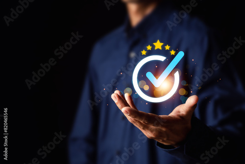 Quality assurance concept. Businessman touching Quality assurance icon on digital screen for ISO certification and standardization.