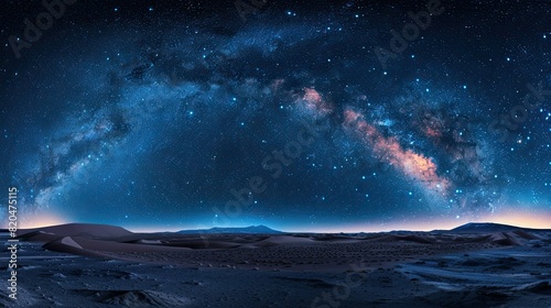 An expansive desert landscape under a starry night sky