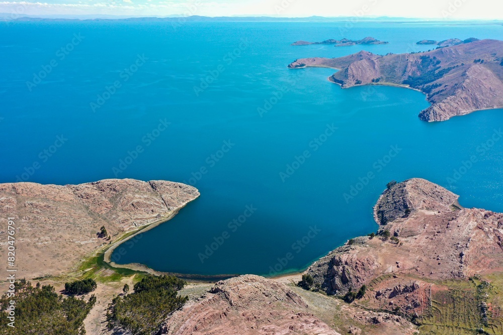 LAKE BAY WITH BLUE WATER AND SPRING MEADOWS LAKE BAY WITH BLUE WATER AND SPRING MEADOWS