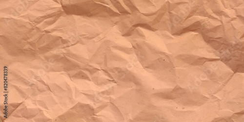 Texture of closed up brown crumpled paper background