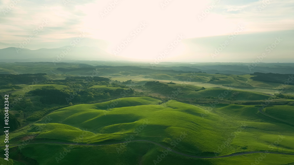 Fototapeta premium Drone aerial shots of spectacular greenery landscapes and blue sky. Dynamic natural scenery.