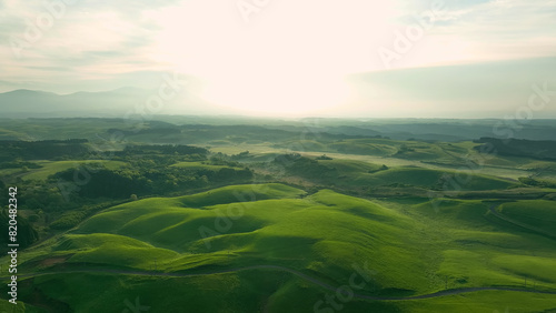 Drone aerial shots of spectacular greenery landscapes and blue sky. Dynamic natural scenery.