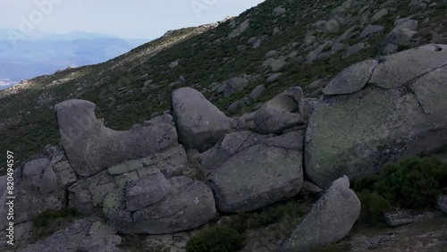 lateral flight with a drone visualizing a striking group of consecutive stones creating a parallax effect by filming in 70mm the set ends in a large ceremonial stone Navarrevisca Avila photo