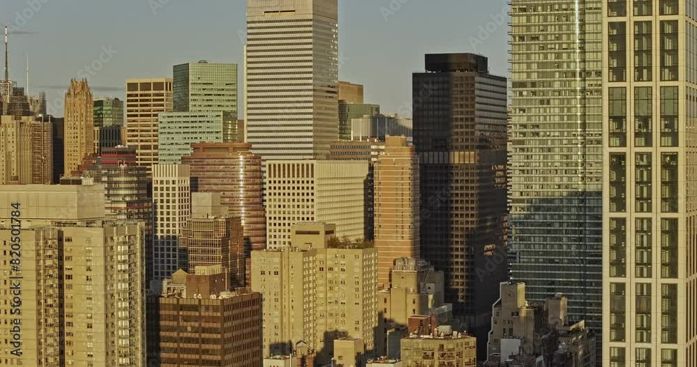 NYC New York Aerial v377 zoomed tracking left shot drone flyover capturing sunrise urban cityscape with densely populated skyscrapers in Midtown Manhattan - Shot with Mavic 3 Pro Cine - September 2023 NYC New York Aerial v377 zoomed tracking left shot drone flyover capturing sunrise urban cityscape with densely populated skyscrapers in Midtown Manhattan - Shot with Mavic 3 Pro Cine - September 2023